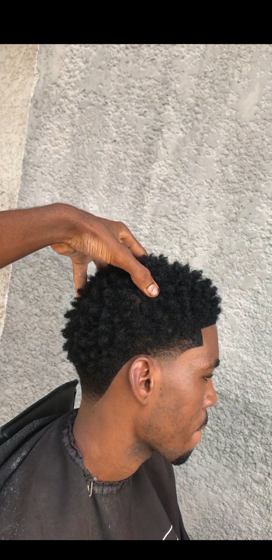 A simple fade and long hair rolls for a perfect fit